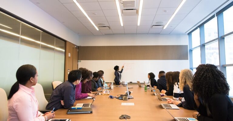 Business meeting with diverse team discussing projects in a modern conference room.